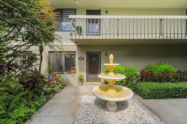 800 NW Fork Rd Unit 7-3, Stuart, FL 34994 - entrance to property with stucco siding and a balcony