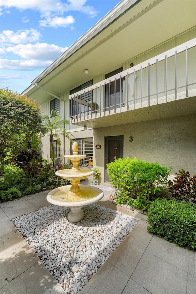800 NW Fork Rd Unit 7-3, Stuart, FL 34994 - property entrance featuring board and batten siding, stucco siding, and a balcony