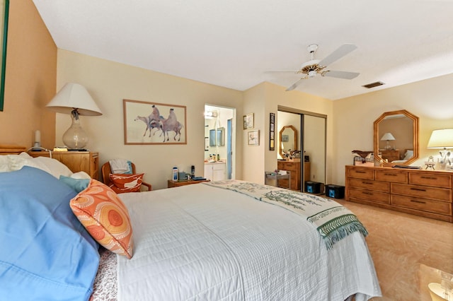 carpeted bedroom featuring ceiling fan, connected bathroom, and a closet