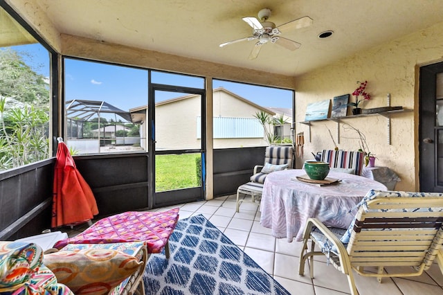 sunroom / solarium with ceiling fan