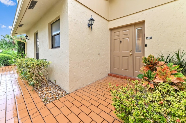 doorway to property with a patio area