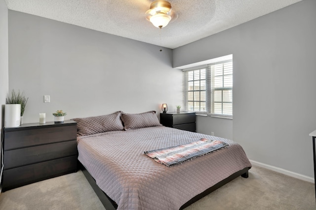 carpeted bedroom with a textured ceiling