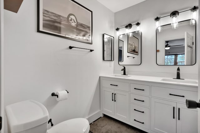 bathroom featuring ceiling fan, vanity, and toilet