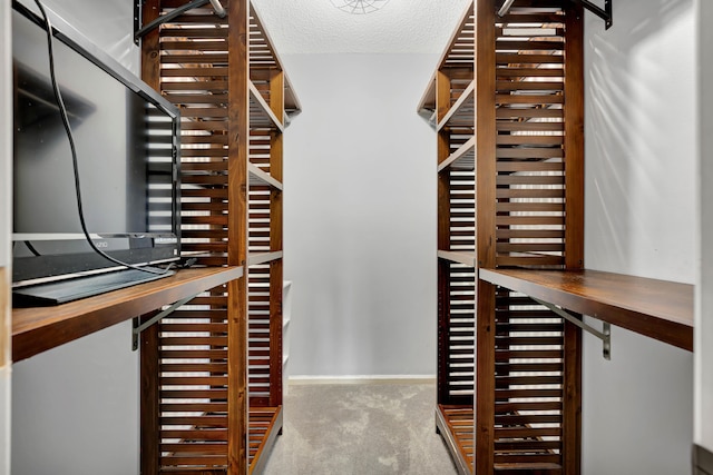 wine area with a textured ceiling and carpet floors