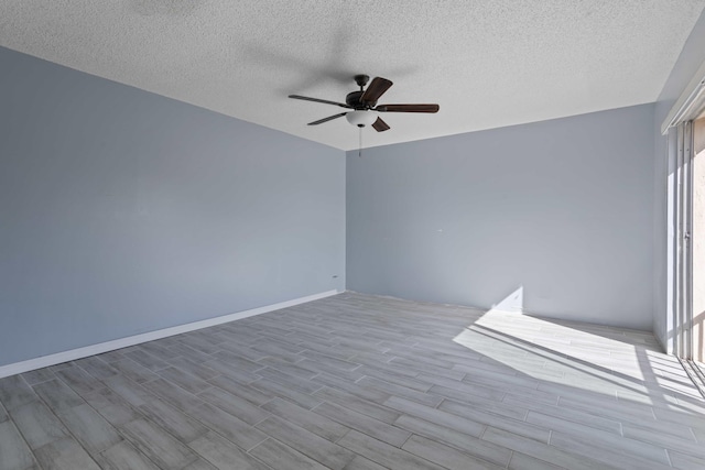 interior space with ceiling fan, light hardwood / wood-style flooring, and a textured ceiling