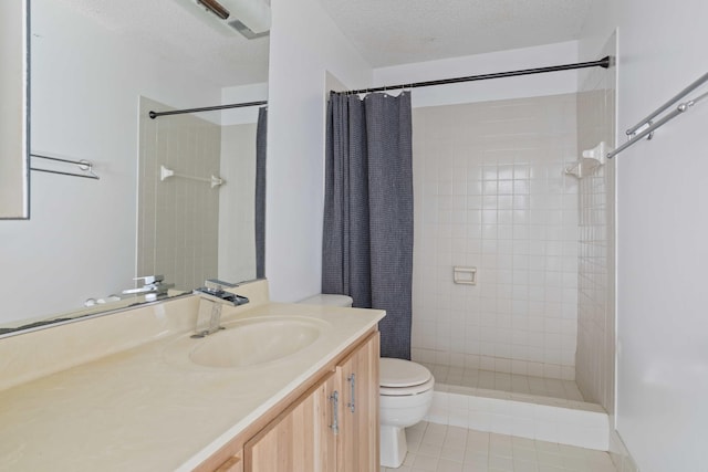 bathroom with tile patterned floors, a textured ceiling, toilet, vanity, and a shower with shower curtain