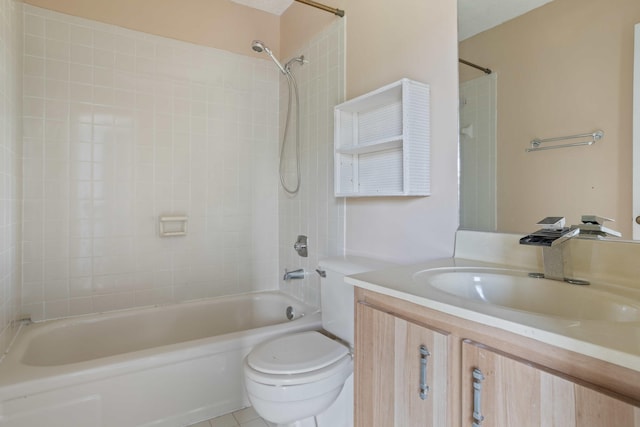 full bathroom featuring tile patterned flooring, vanity, toilet, and tiled shower / bath combo