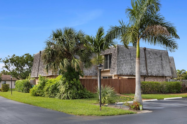 view of property exterior with a yard