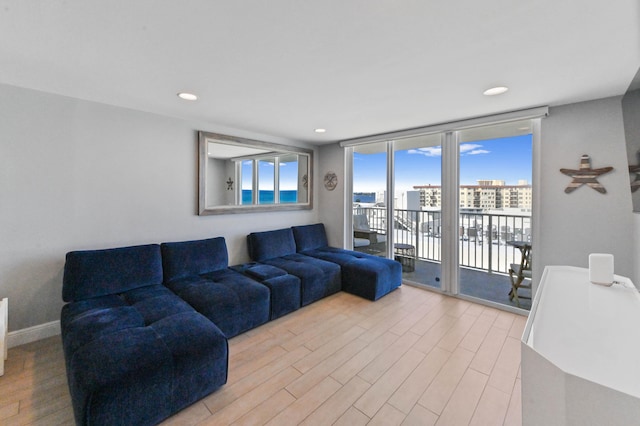 living room with light hardwood / wood-style flooring