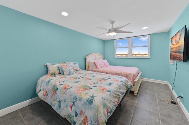 bedroom with dark tile patterned flooring and ceiling fan