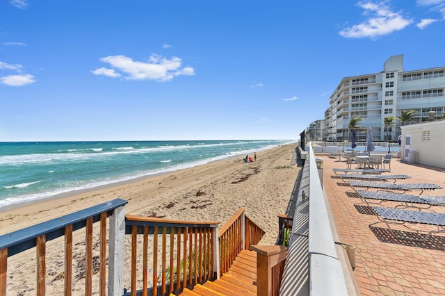 view of water feature with a beach view