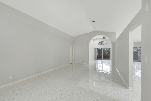 unfurnished room with ceiling fan, light tile patterned floors, and lofted ceiling