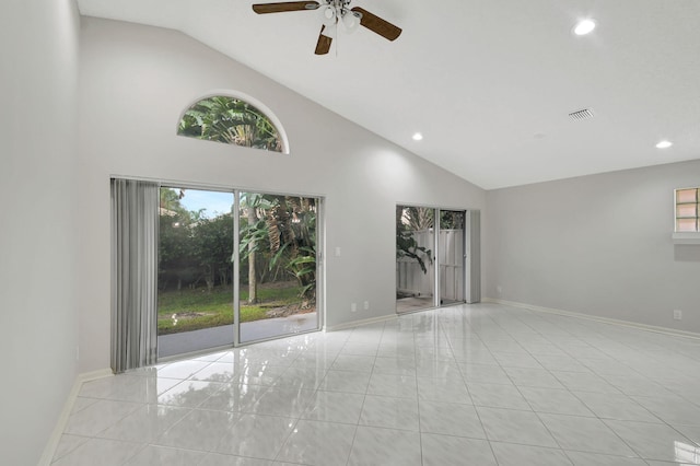 unfurnished living room featuring a wealth of natural light, ceiling fan, and high vaulted ceiling