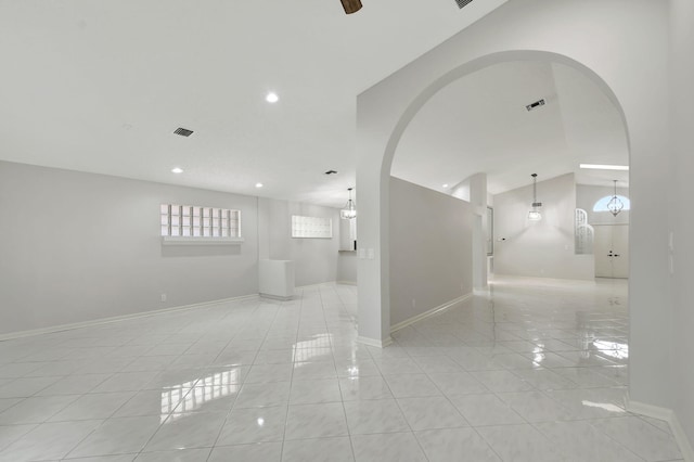 interior space with a notable chandelier and light tile patterned floors