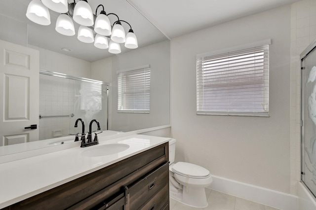 bathroom with tile patterned floors, vanity, and toilet