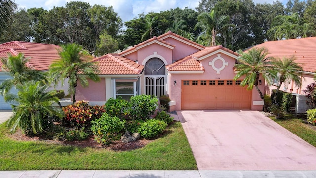 mediterranean / spanish-style home with a garage