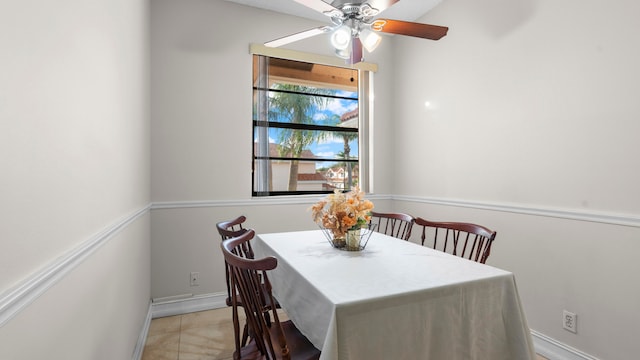 tiled dining room with ceiling fan