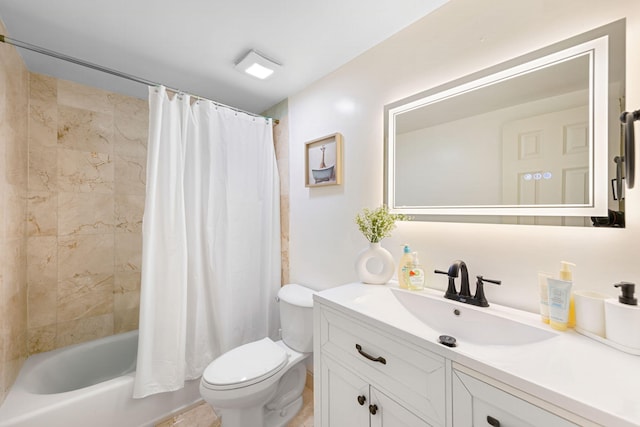 full bathroom with vanity, shower / tub combo, and toilet