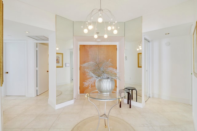 interior space with light tile patterned flooring and a chandelier