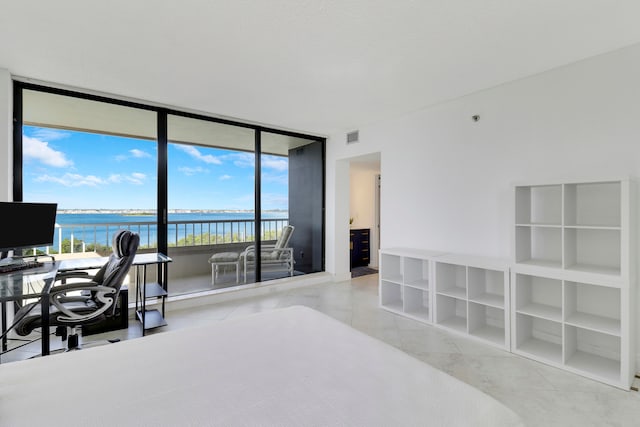 tiled office with a water view and a wall of windows