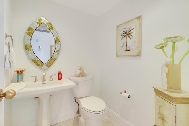 bathroom featuring tile patterned floors and toilet