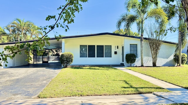 single story home with a carport and a front lawn