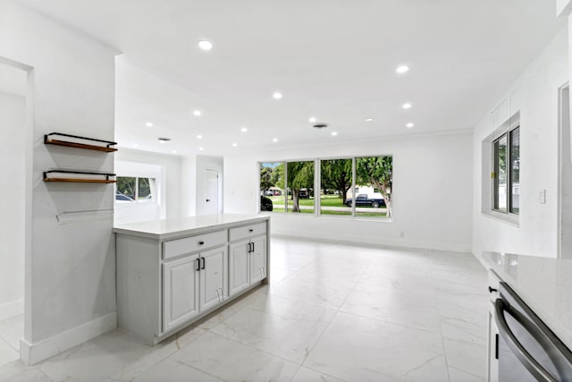 kitchen with white cabinets and stainless steel dishwasher