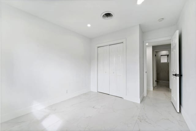 unfurnished bedroom featuring a closet