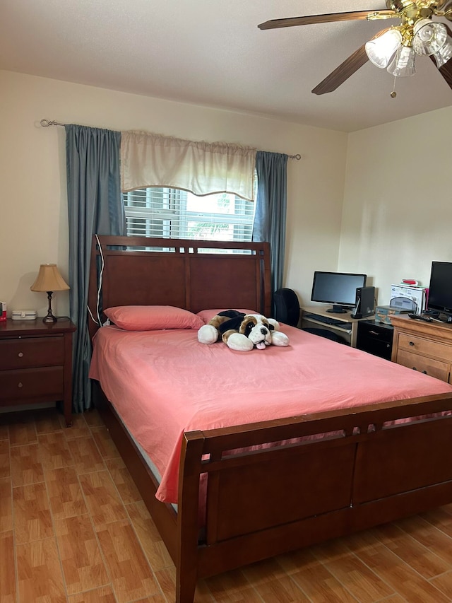 bedroom featuring light hardwood / wood-style floors and ceiling fan