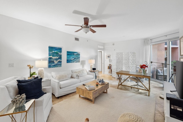 tiled living room featuring ceiling fan