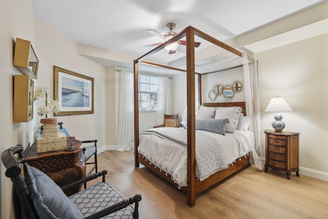 bedroom with ceiling fan and light hardwood / wood-style floors