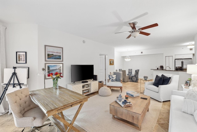 tiled living room with ceiling fan