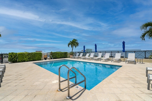 view of swimming pool with a patio