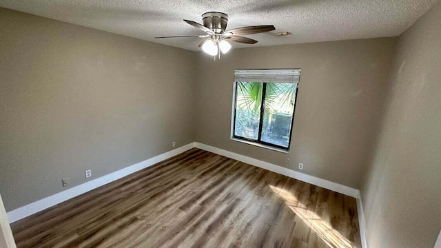 unfurnished room with a textured ceiling, wood-type flooring, and ceiling fan