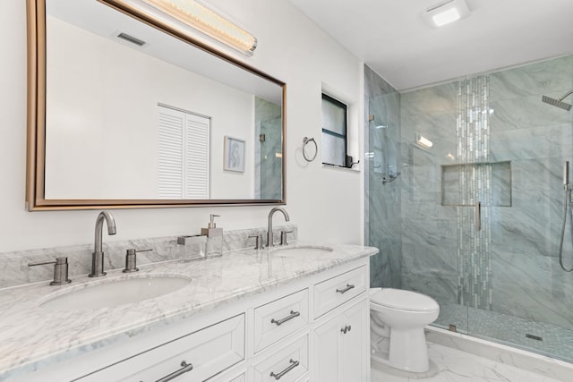 bathroom with toilet, vanity, and walk in shower