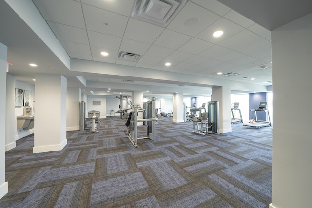 exercise room with dark colored carpet