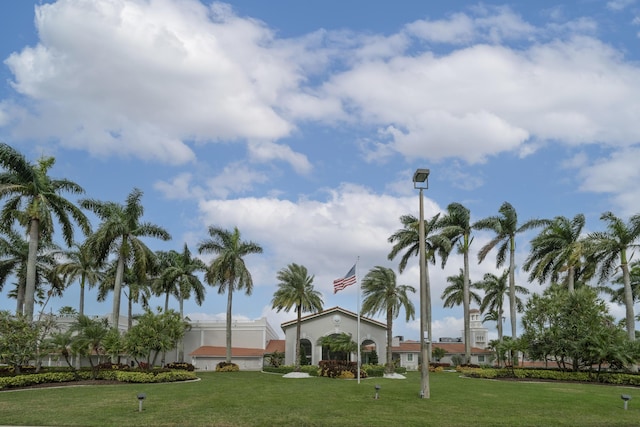 view of home's community with a yard