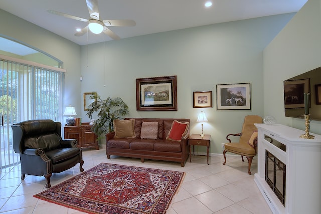 living room with ceiling fan and light tile patterned floors