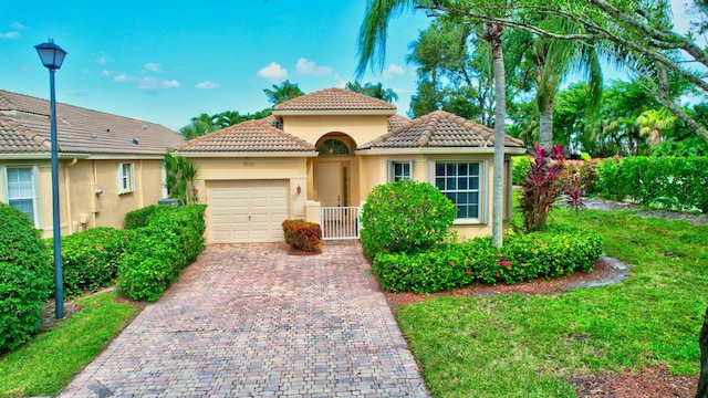 view of front facade with a garage and a front yard