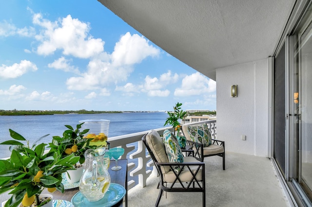 balcony featuring a water view