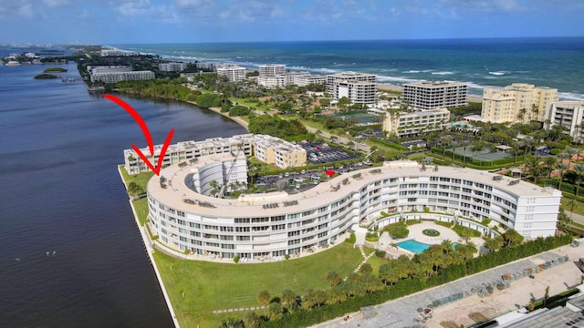 birds eye view of property with a water view