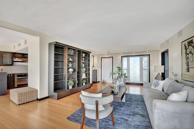 living room with light hardwood / wood-style flooring