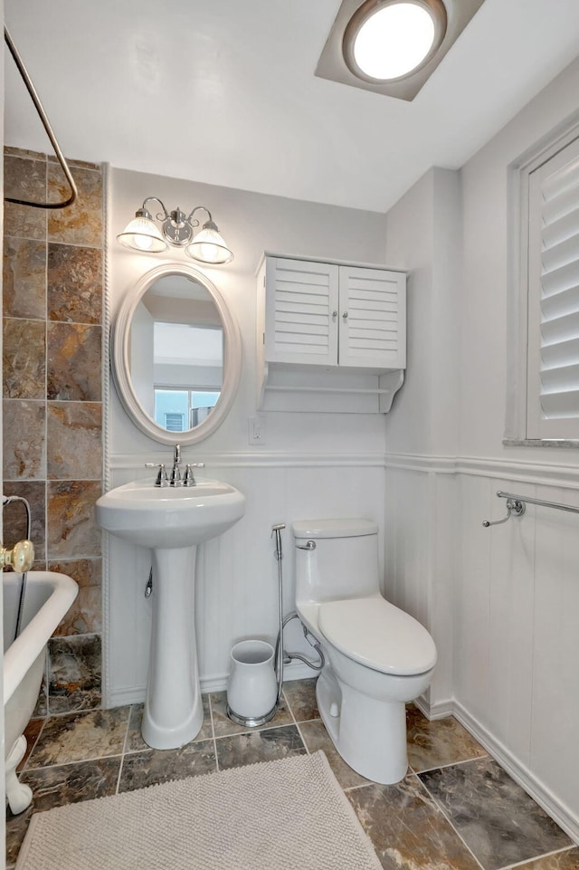 bathroom with a bathtub and toilet