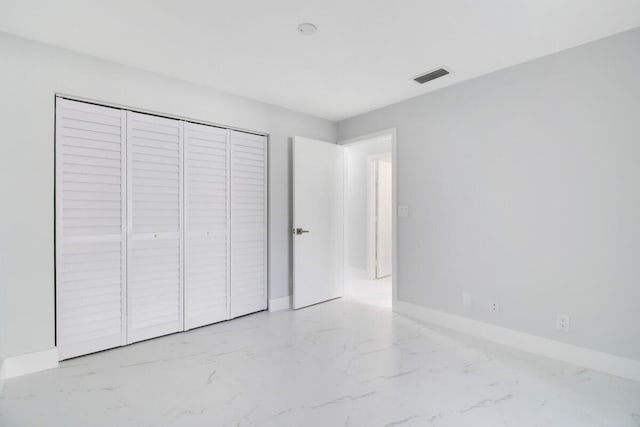 unfurnished bedroom featuring a closet