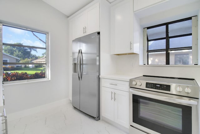 kitchen with white cabinetry and appliances with stainless steel finishes