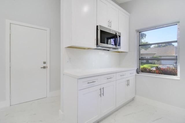 kitchen featuring white cabinetry