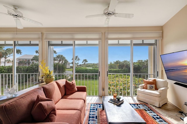 sunroom / solarium featuring ceiling fan and a healthy amount of sunlight