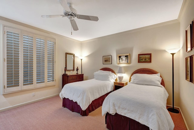 carpeted bedroom featuring crown molding and ceiling fan