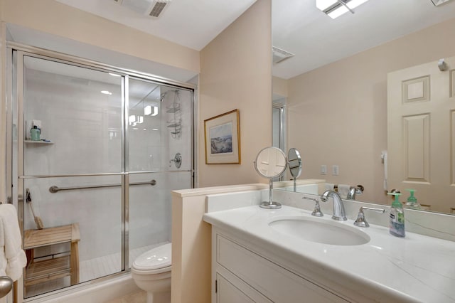 bathroom featuring vanity, toilet, and walk in shower