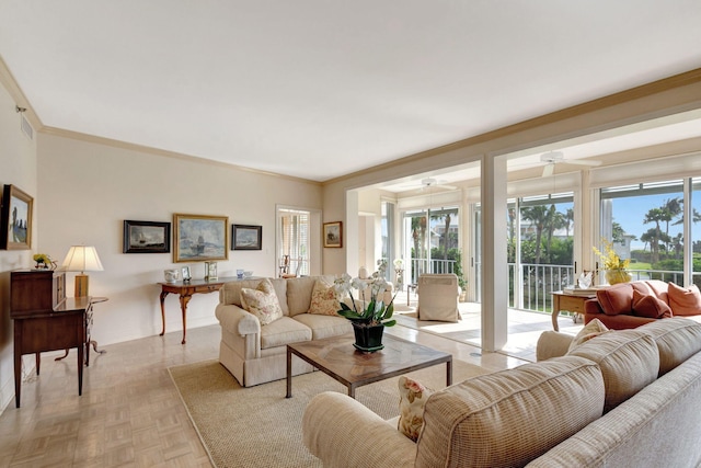 living room with light parquet flooring and ornamental molding